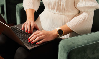 woman typing on a laptop