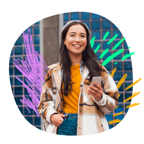 Woman holding a phone while smiling