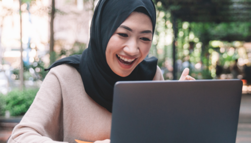 malay woman using her laptop