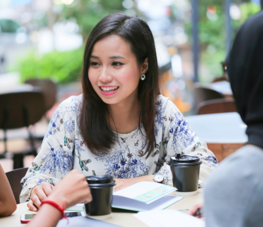 woman chatting with colleagues