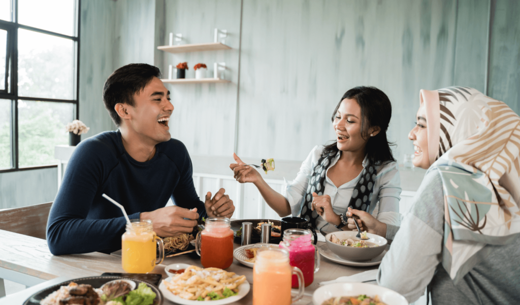 a group of friends eating together