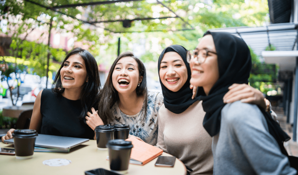 a group of women working together and smiling