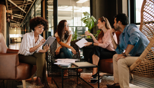 bunch of colleagues discussing things in office